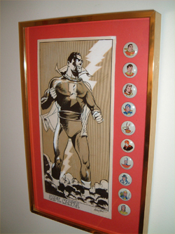 A Don Newton original of Captain Marvel framed with a set of the Fawcett pin set